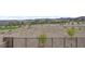 Backyard view from balcony with natural desert landscape, and a metal fence at 12123 Glentana View St, Las Vegas, NV 89138