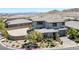 Two-story home featuring a tile roof, paved driveway, and large, landscaped backyard at 12311 Middle Creek St, Las Vegas, NV 89138