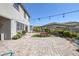 Large backyard with a brick paver patio and green grass is great for entertaining at 12311 Middle Creek St, Las Vegas, NV 89138