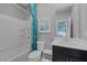 Inviting bathroom with a shower-tub combination, bright vanity and modern fixtures at 12311 Middle Creek St, Las Vegas, NV 89138