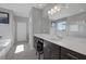 Bright bathroom featuring a modern vanity, large mirror, and soaking tub with natural light at 12311 Middle Creek St, Las Vegas, NV 89138