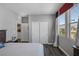 Bright bedroom featuring a full bed, closet, and a view of the mountains at 12311 Middle Creek St, Las Vegas, NV 89138