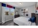 Comfortable bedroom featuring a full bed, dresser, and a view of the mountains at 12311 Middle Creek St, Las Vegas, NV 89138