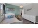 Comfortable bedroom with natural light, unique decor, hard wood floors and bright furnishings at 12311 Middle Creek St, Las Vegas, NV 89138