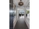 Inviting foyer with modern light fixtures and hardwood floors leading into a spacious living area at 12311 Middle Creek St, Las Vegas, NV 89138