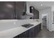 A modern gas cooktop set in a light countertop surrounded by gray cabinets offers the perfect cooking space at 12311 Middle Creek St, Las Vegas, NV 89138