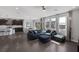 A cozy living room blends into the dining and kitchen, ideal for entertaining or relaxing in style at 12311 Middle Creek St, Las Vegas, NV 89138