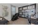 Stylish home office with a comfortable massage chair, built-in shelving, and a sleek modern design at 12311 Middle Creek St, Las Vegas, NV 89138