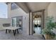 Stylish outdoor patio featuring an outdoor fireplace, dining area, and seamless indoor/outdoor living at 12311 Middle Creek St, Las Vegas, NV 89138