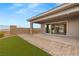 This home features a covered patio area, artificial turf, and a brick-paved walkway at 12550 Point Sierra St, Las Vegas, NV 89138