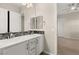 Bathroom with double sinks, modern fixtures, and a large mirror enhancing the spacious feel of the room at 12550 Point Sierra St, Las Vegas, NV 89138