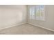 Neutral bedroom with carpeted floor and bright windows providing ample natural light and comfort at 12550 Point Sierra St, Las Vegas, NV 89138