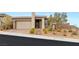 Charming single-story home featuring a well-manicured front yard, desert landscaping, and an attached two-car garage at 12550 Point Sierra St, Las Vegas, NV 89138