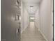 Bright hallway with wood flooring, recessed lighting, and neutral walls leading into an open floorplan at 12550 Point Sierra St, Las Vegas, NV 89138