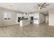 Open concept kitchen with stainless steel appliances, white cabinetry, and seamless access to dining area at 12550 Point Sierra St, Las Vegas, NV 89138