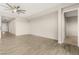 Open living room features modern ceiling fan and wood-look tile flooring at 12550 Point Sierra St, Las Vegas, NV 89138