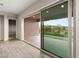 Bright living room with seamless sliding doors with views to the mountain and access to the patio at 12550 Point Sierra St, Las Vegas, NV 89138