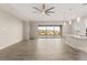 Spacious living room featuring a ceiling fan, recessed lighting, and sliding doors that overlook the backyard at 12550 Point Sierra St, Las Vegas, NV 89138