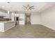 Bright, open floor plan with tile flooring, recessed lighting, and modern ceiling fan at 12550 Point Sierra St, Las Vegas, NV 89138