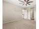 Neutral Primary bedroom with ceiling fan, ensuite bath, and plush carpet at 12550 Point Sierra St, Las Vegas, NV 89138