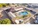 Aerial view of home with a custom swimming pool, patio, and outdoor living space, surrounded by desert landscape at 1500 Tumbleweed Dr, Henderson, NV 89002