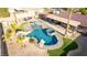 Aerial view showcasing a swimming pool with spa, rock features, and outdoor living space in a desert backyard setting at 1500 Tumbleweed Dr, Henderson, NV 89002