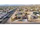 Expansive aerial view of a desert home featuring a pool, solar panels, and a large yard in a residential neighborhood at 1500 Tumbleweed Dr, Henderson, NV 89002