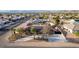 Aerial shot of a home with solar panels, an extended driveway, and desert landscaping at 1500 Tumbleweed Dr, Henderson, NV 89002