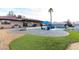 Spacious backyard features a pool, spa, fire pit, and artificial grass, perfect for outdoor entertaining at 1500 Tumbleweed Dr, Henderson, NV 89002