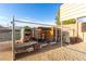 Backyard chicken coop made of wood and wire mesh sitting on a gravel area at 1500 Tumbleweed Dr, Henderson, NV 89002