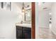 Half bathroom featuring black vanity with designer hardware and pendant lighting at 1500 Tumbleweed Dr, Henderson, NV 89002