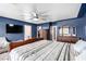 Primary bedroom featuring an ensuite bathroom, walk-in closet, and plush carpeting for a comfortable and relaxing atmosphere at 1500 Tumbleweed Dr, Henderson, NV 89002