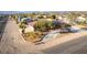 Charming single-story house with solar panels, a long driveway, and desert landscaping at 1500 Tumbleweed Dr, Henderson, NV 89002