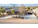 Beautiful single-story home with solar panels, desert landscaping, and a long driveway at 1500 Tumbleweed Dr, Henderson, NV 89002