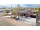 Single-story home featuring solar panels, desert landscaping, and an extended driveway at 1500 Tumbleweed Dr, Henderson, NV 89002
