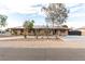 Charming single-story home boasting a tile roof, desert landscaping, and solar panels at 1500 Tumbleweed Dr, Henderson, NV 89002