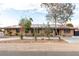 Charming single-story home featuring desert landscaping and solar panels on the tile roof at 1500 Tumbleweed Dr, Henderson, NV 89002