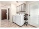 Laundry room with tile floors, cabinets, and modern washer and dryer at 1500 Tumbleweed Dr, Henderson, NV 89002