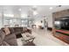 Open-concept living area featuring tile flooring, neutral walls, and lots of natural light at 1500 Tumbleweed Dr, Henderson, NV 89002