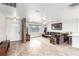 Spacious living room featuring tile floors, large windows, and stone accent walls at 1500 Tumbleweed Dr, Henderson, NV 89002