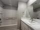 Bathroom with shower and tub combination, updated vanity and fixtures at 2105 William Holden Ct, Las Vegas, NV 89142