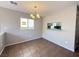 Dining area featuring an adjacent window, light fixture, and tile floors at 2105 William Holden Ct, Las Vegas, NV 89142