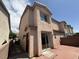 Back exterior view of home with brick patio at 2105 William Holden Ct, Las Vegas, NV 89142