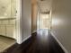 Hallway featuring vinyl floors, closet, and doors to adjacent rooms at 2105 William Holden Ct, Las Vegas, NV 89142