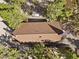 An aerial view shows a home with a brown roof nestled among mature trees at 2160 Via Vita St, Mount Charleston, NV 89124