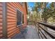 Inviting balcony features seating, wood railings, and views of the surrounding nature at 2160 Via Vita St, Mount Charleston, NV 89124
