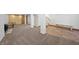 Finished basement with carpet, wood-burning stove, columns, stairs, and wood accent wall at 2160 Via Vita St, Mount Charleston, NV 89124