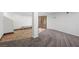 Finished basement area with wood-look tile flooring and carpet, featuring a bench and glass doors at 2160 Via Vita St, Mount Charleston, NV 89124