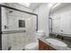 Modern bathroom features glass shower, tiled walls, and modern vanity at 2160 Via Vita St, Mount Charleston, NV 89124