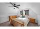 Bright bedroom with wooden furniture, neutral carpet, and large windows with views at 2160 Via Vita St, Mount Charleston, NV 89124